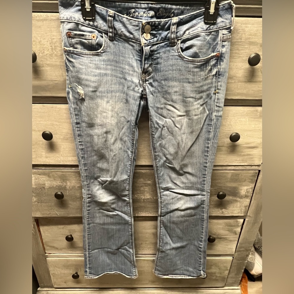 Lightly worn light washed flare legged jeans (short)